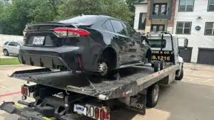 Black car being towed
