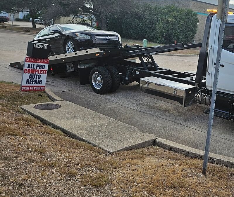 How Do Professionals Use a Rollback Wrecker Truck for Accident-Damaged Vehicles?